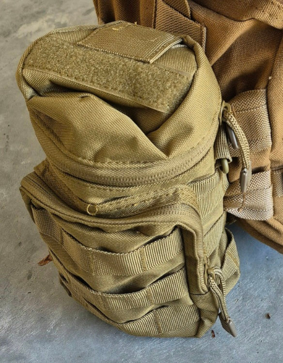 GS-008 Tan Molle Bottle Pouch viewed at angle on concrete surface, showing front flap, side panel contouring, and external strap layout; built from rip-stop nylon for modular hydration carry in arid environments